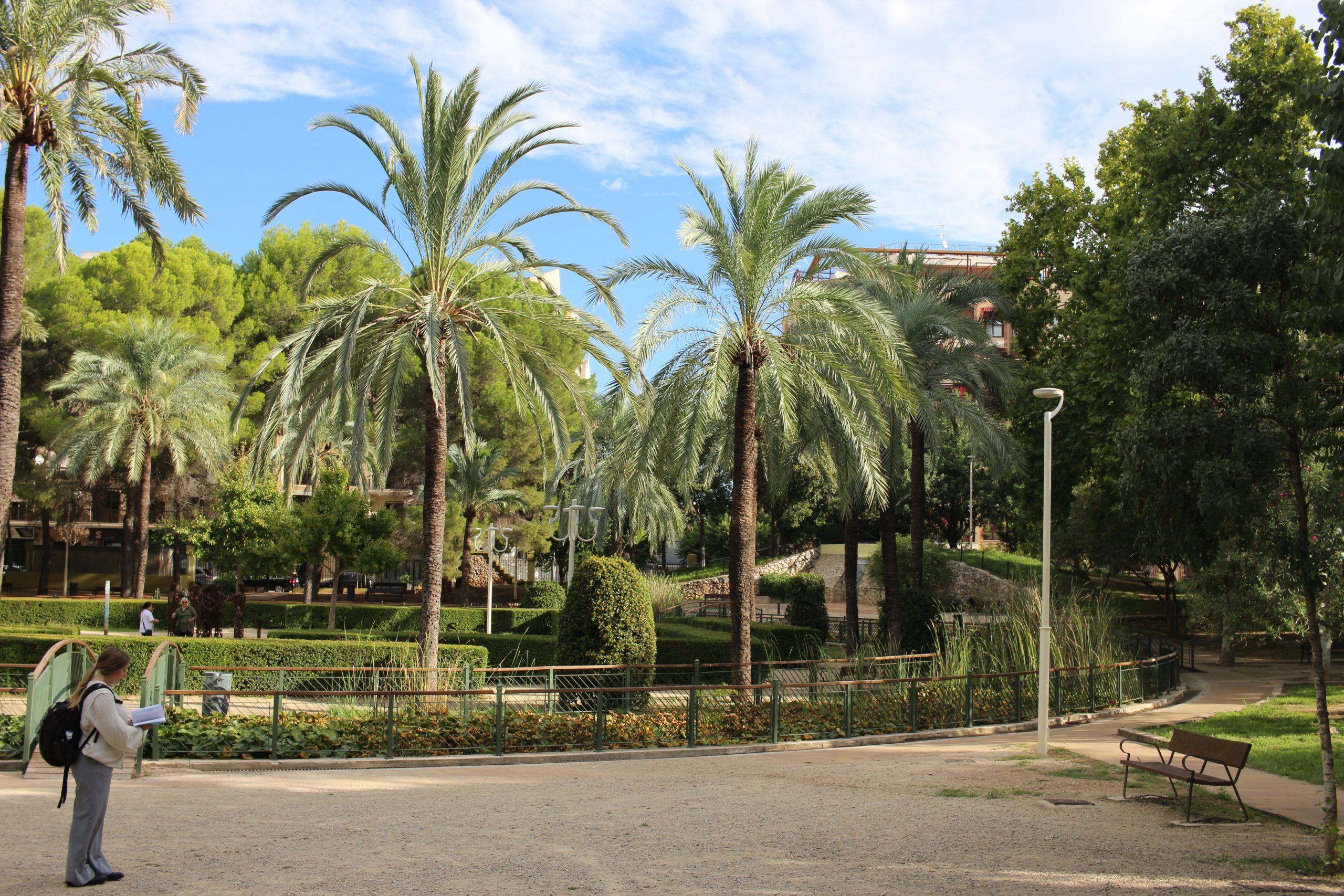 girl in parc de sant pere surrounded by trees