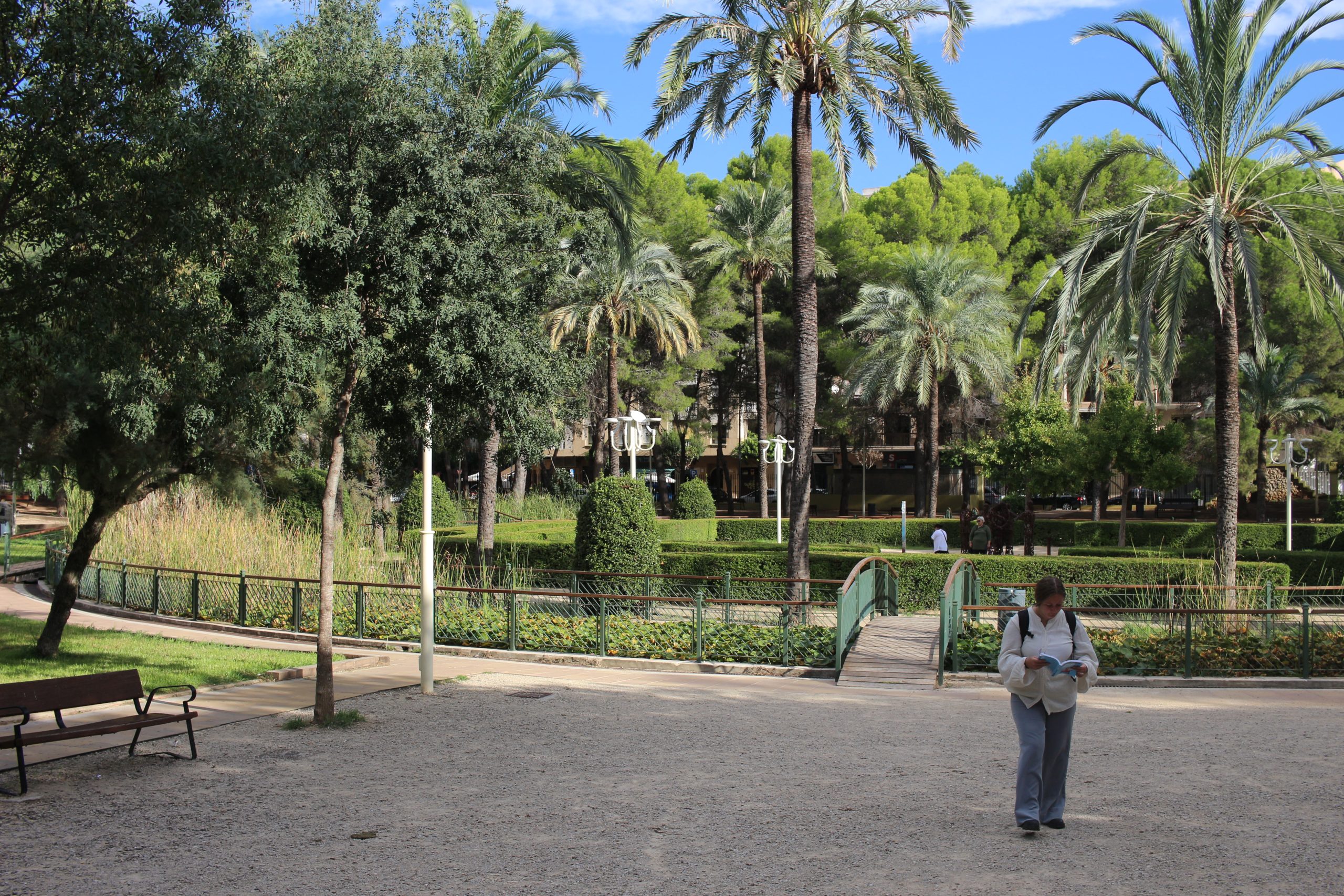 girl walking in parc de sant pere in Gandia